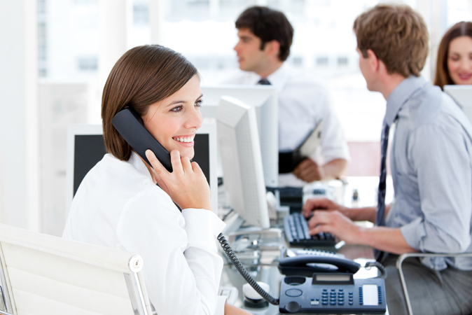 Woman in office on phone