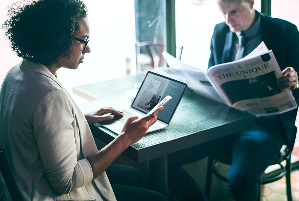 Woman on phone and laptop