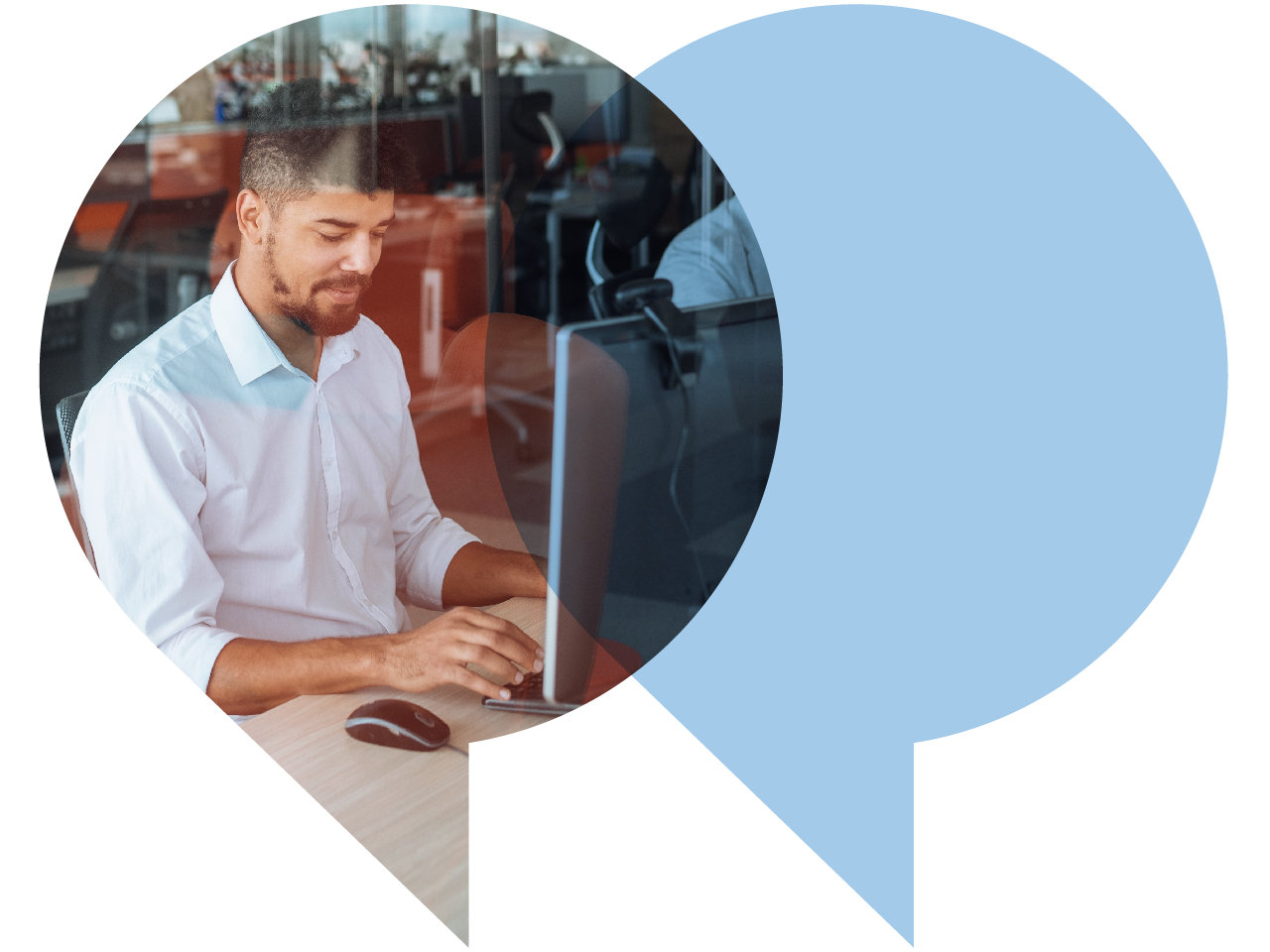 man typing at desktop computer