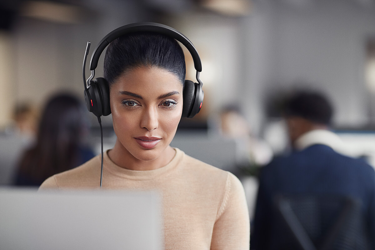 Woman using Jabra Evolve2 40 headset for Microsoft Teams